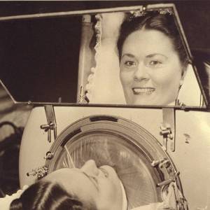 Jane Boyle Needham, quite literally "looking up", into the mirror attached to her iron lung, which allowed her to view her world.